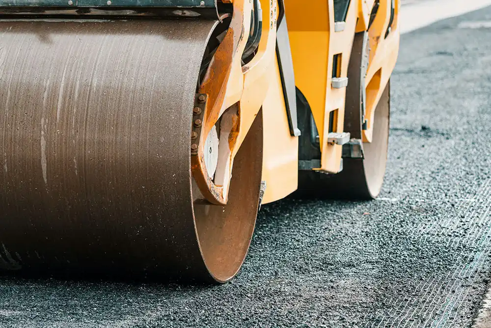 A roller-compactor pressing asphalt